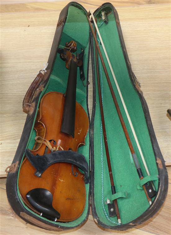 An early 20th century violin with fake label and an Italian piano accordian